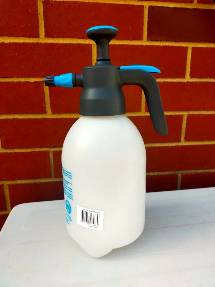 White spray bottle with pump action.